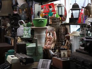 service-1 A vibrant collection of vintage and antique items inside a cluttered shop.
