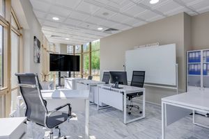 service-1 Spacious and bright modern office interior with sleek furniture, ideal for professional workspaces.
